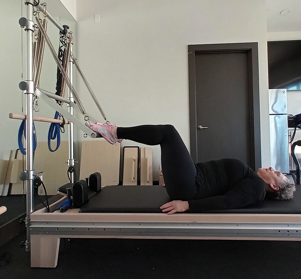pilates-push-through-bar-bridge-with-feet--bridge-zoe-zuniga2