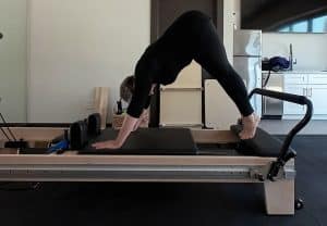 Zoe Zuniga Pilates Trainer Downward dog pike plan on Faittd Reformer tower combo